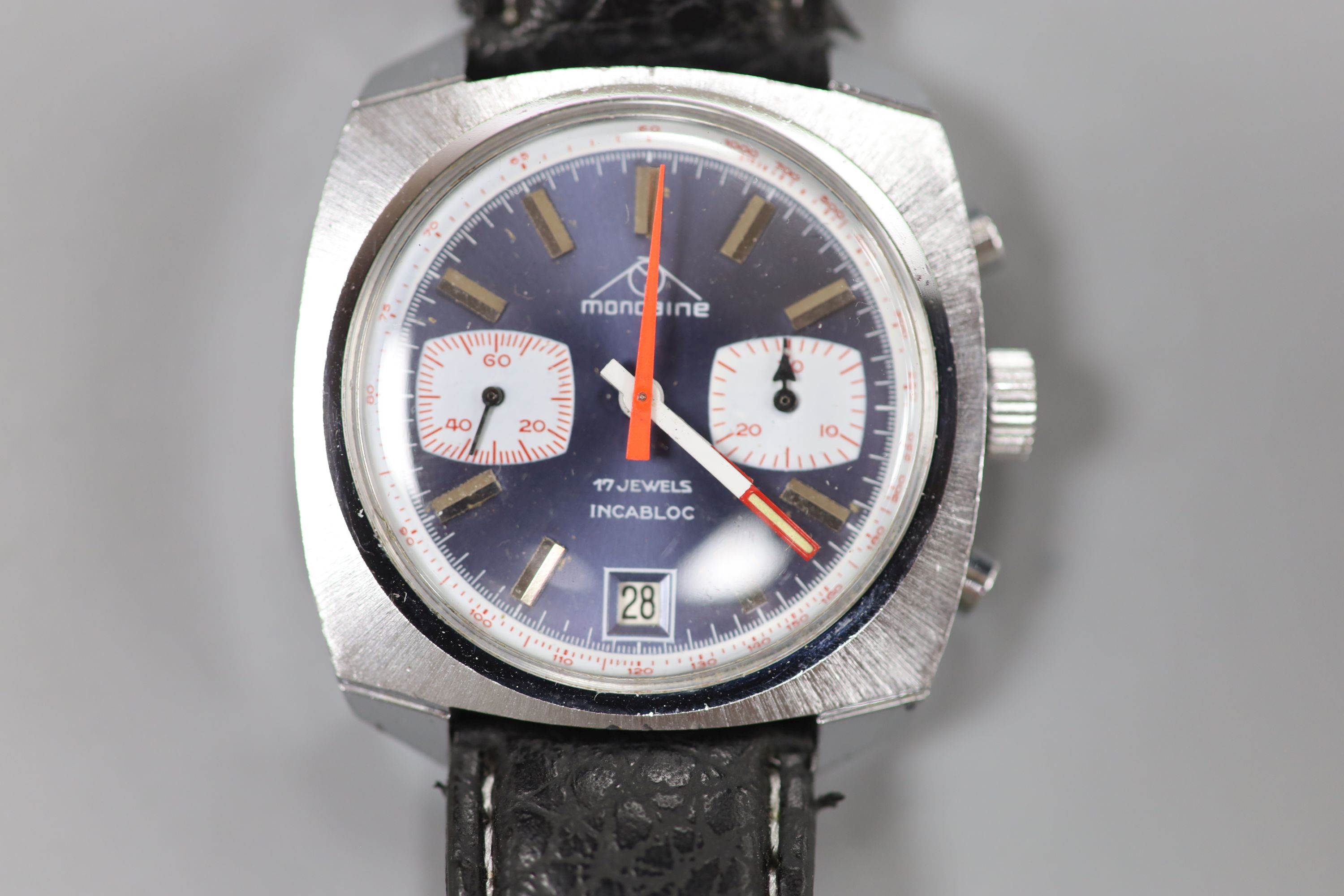 A gentlemans 1970s stainless steel Mondaine chronograph blue dial manual wind wrist watch, in later leather strap.